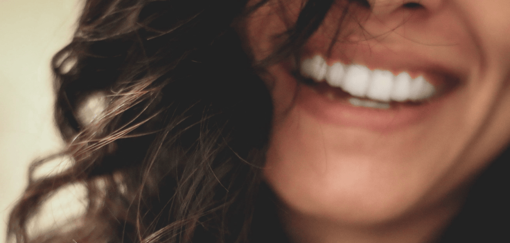 A close-up of a woman with a beautiful smile