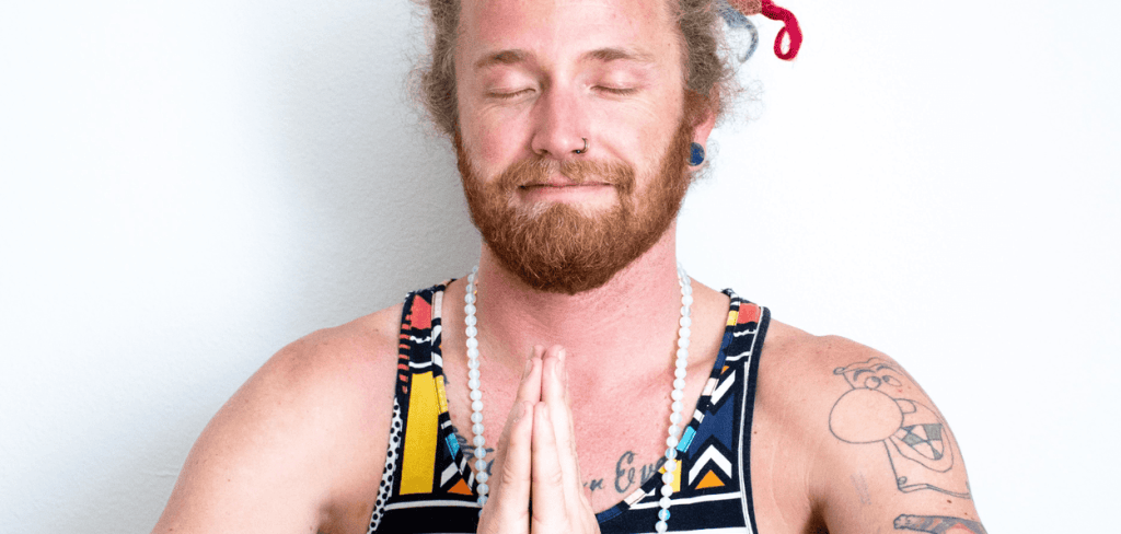 a hippy man mediating