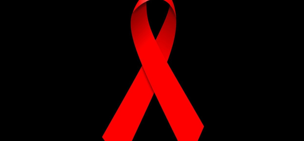 Fight against HIV/AIDS Ribbon Against a Black Background