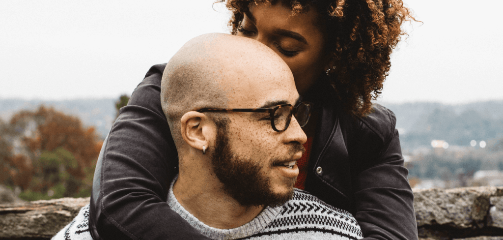 African-American Woman Kissing an African-American with Red freckles