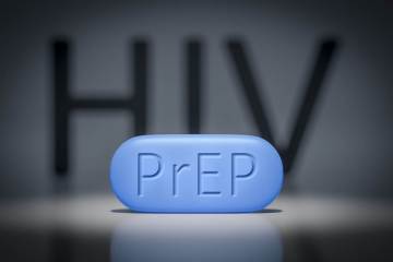Photo of a PrEP bill with HIV in the background
