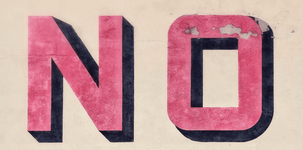 The word NO painted on a street wall