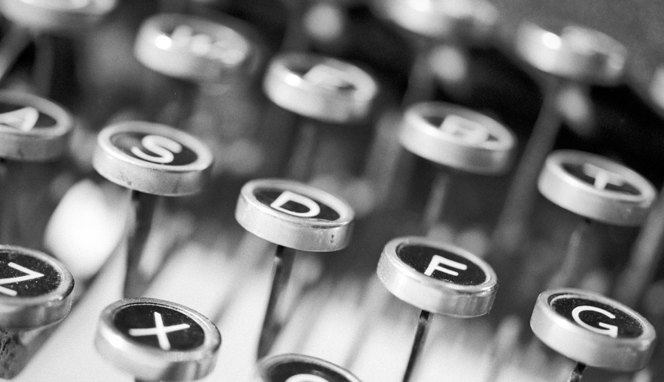 silver typewriter in shallow focus photography