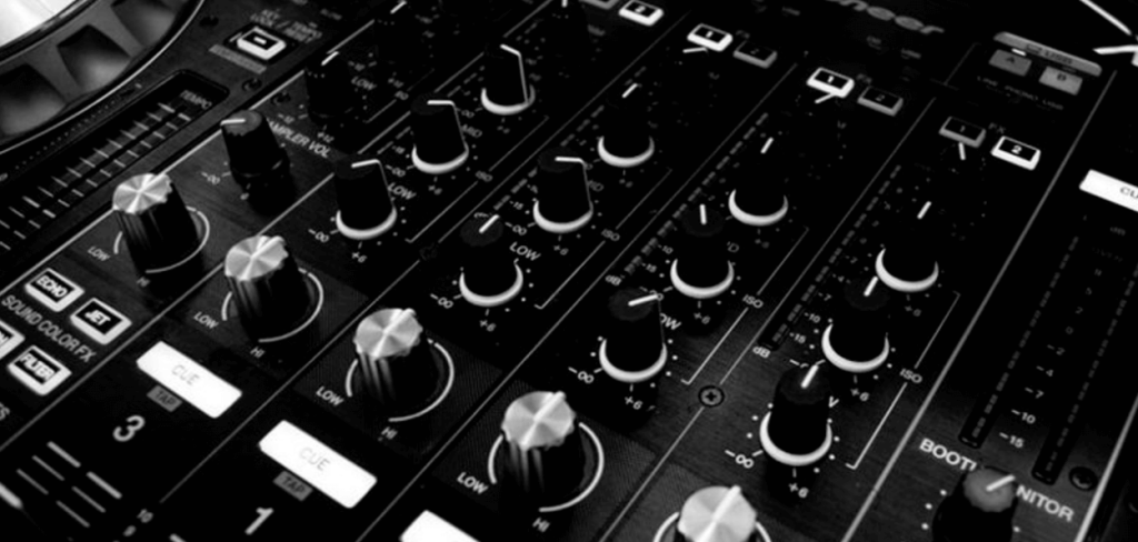 A black and white photo of a DJ Spinning Turntable