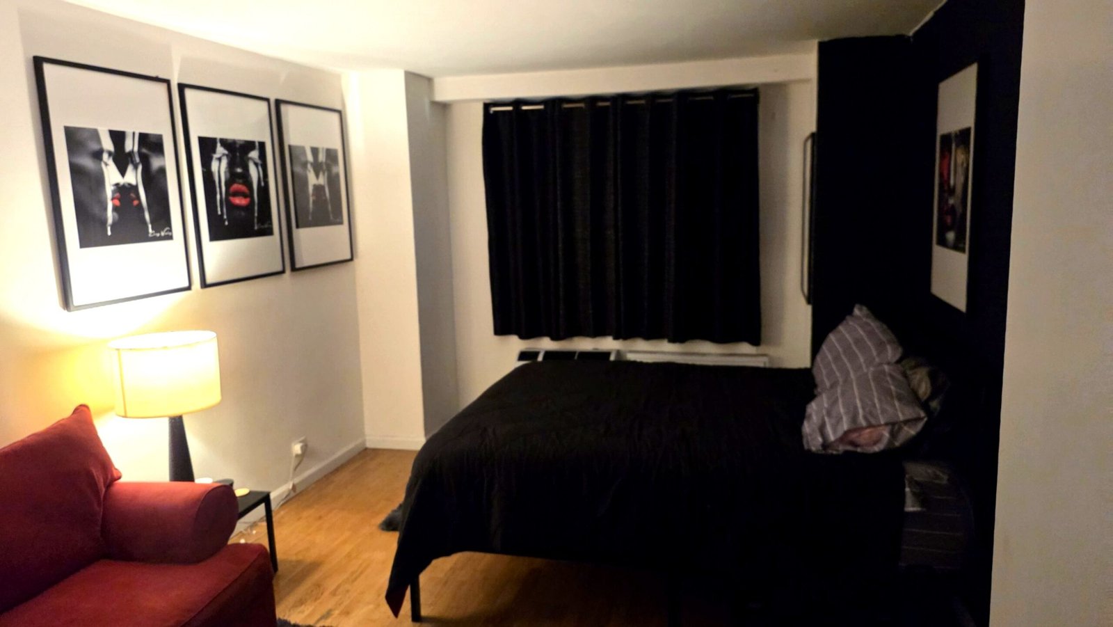 Bedroom with framed series by Corey Wesley
