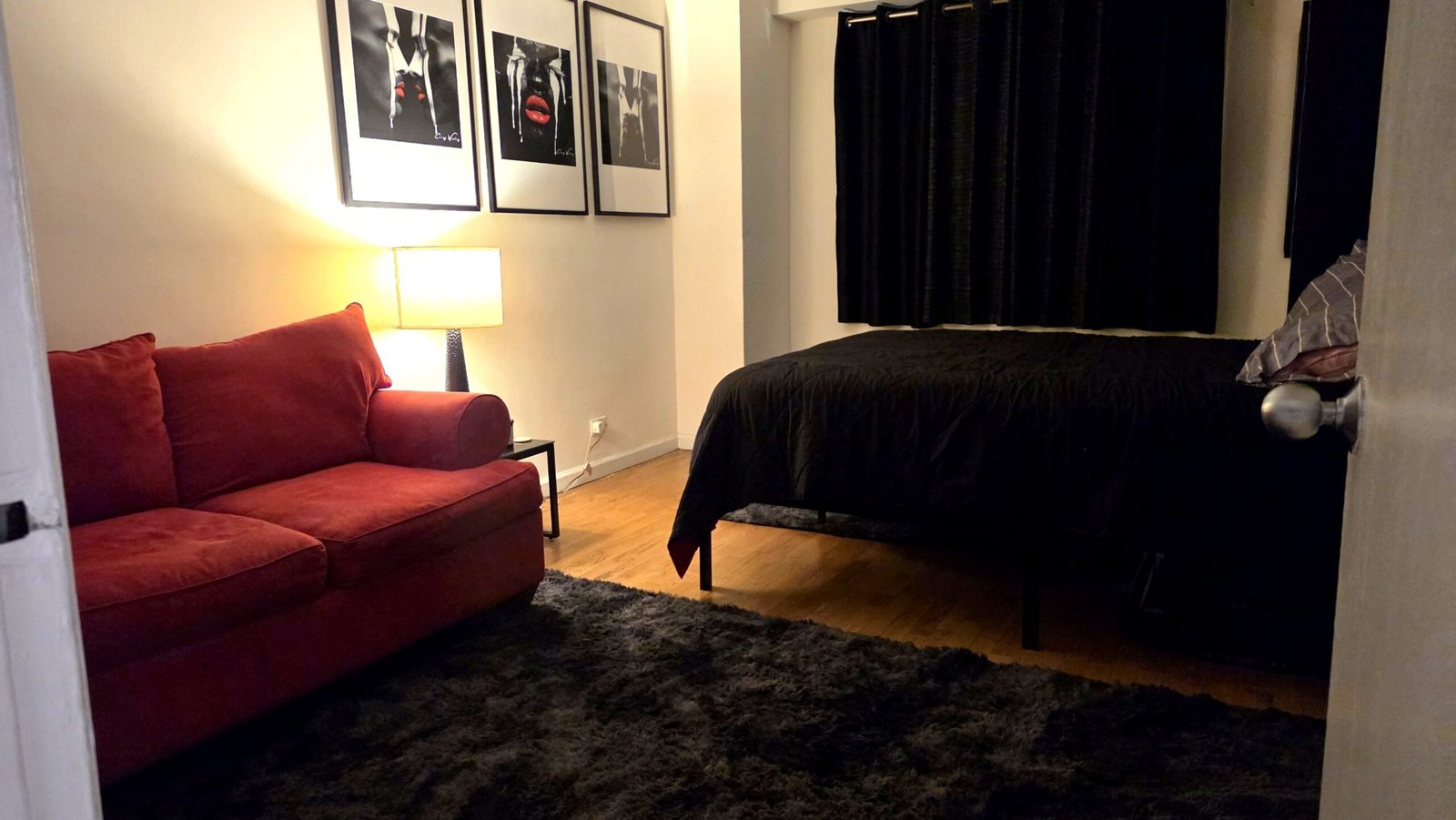 Bedroom with red love seat