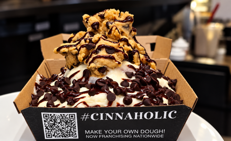 Cookie Monster cinnamon roll from Cinnaholic in Chelsea, topped with cookie dough, chocolate chips, and chocolate drizzle