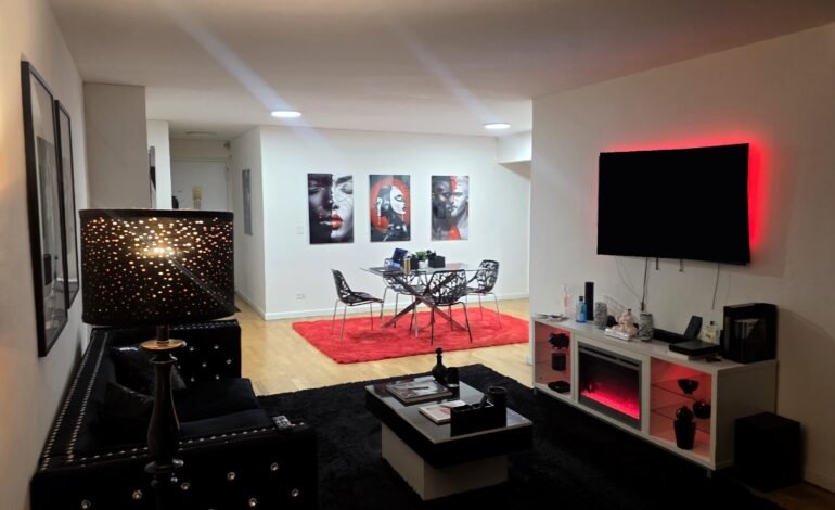 Living room with art by Corey Wesley