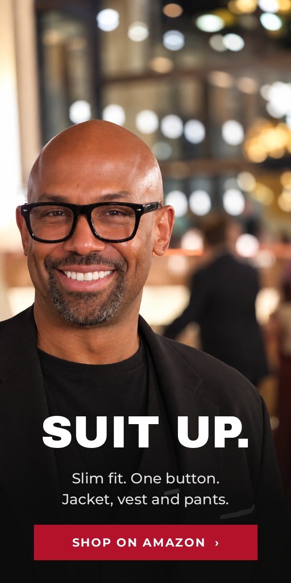 Corey Wesley in a black slim fit 3-piece suit. Shop the suit on Amazon.