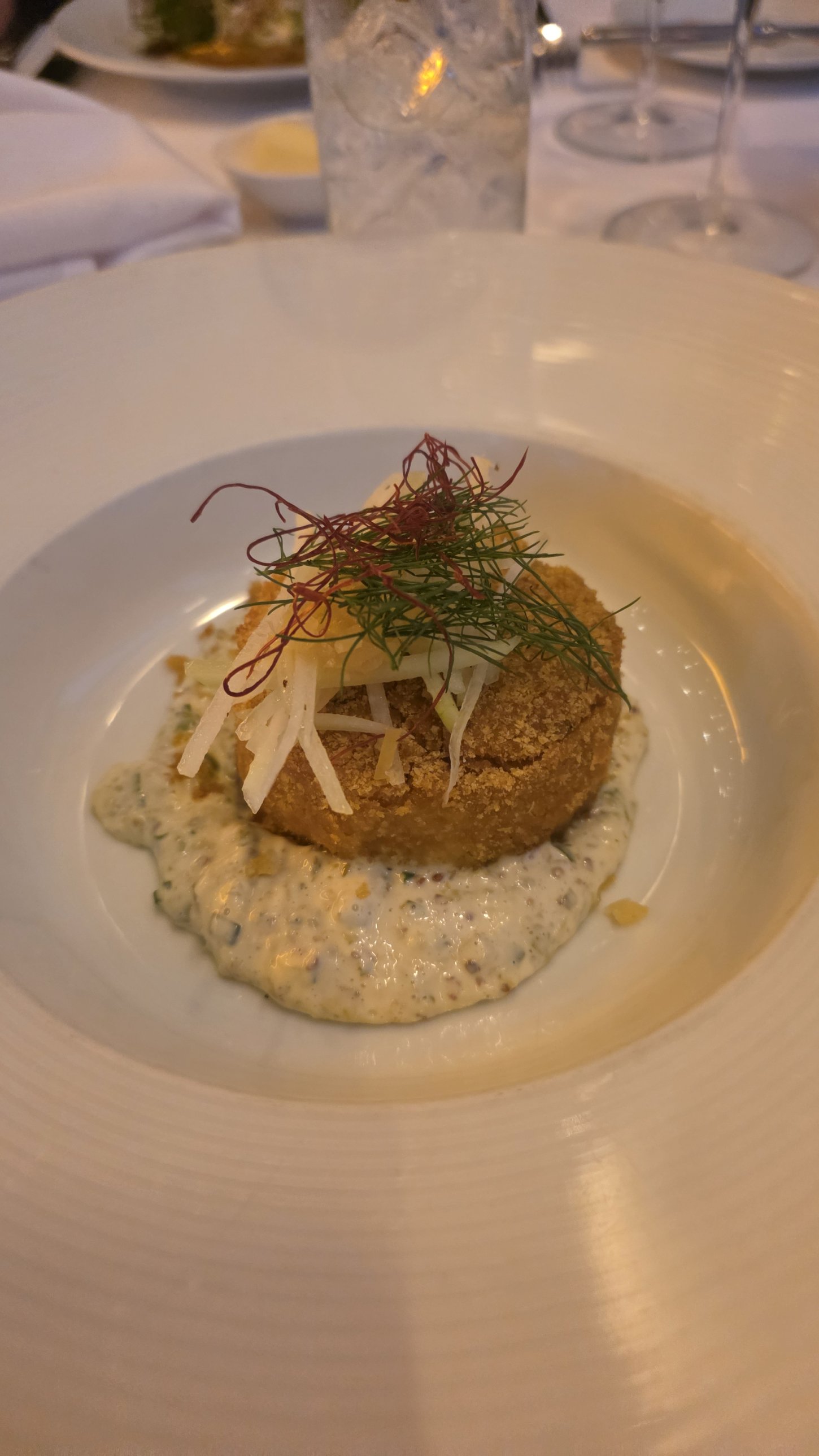 Colossal lump crab cake with kohlrabi slaw at The Grand Tier